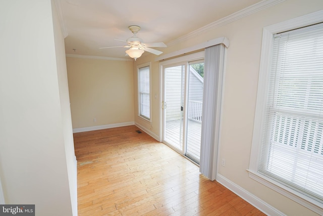 224 Canal Park Dr Unit 104, Salisbury, MD 21804 - unfurnished room with crown molding, light wood-style flooring, baseboards, and ceiling fan
