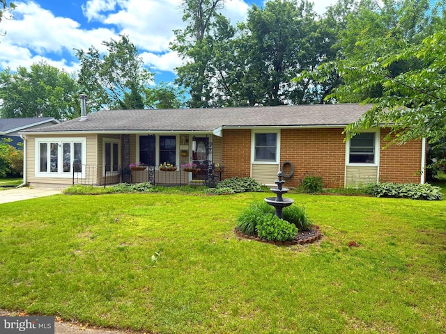 802 Foxwell Rd, Joppa, MD 21085 - single story home with a front lawn and brick siding