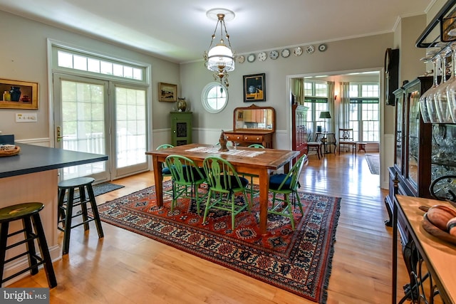 170 Vaughndom Way, Martinsburg, WV 25404 - dining space with healthy amount of natural light, ornamental molding, light wood-style flooring, and a wainscoted wall