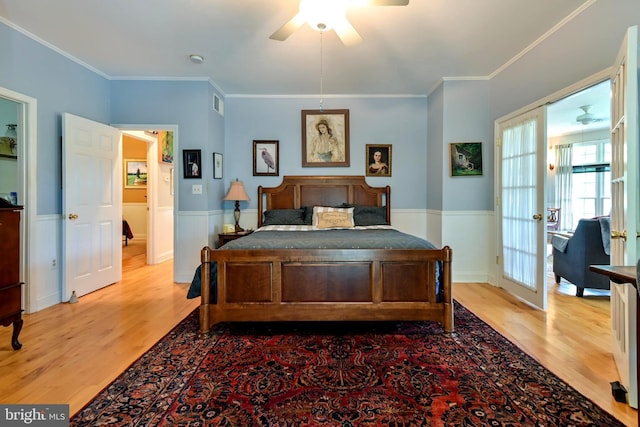 170 Vaughndom Way, Martinsburg, WV 25404 - bedroom with light wood-style flooring, a wainscoted wall, crown molding, and ceiling fan