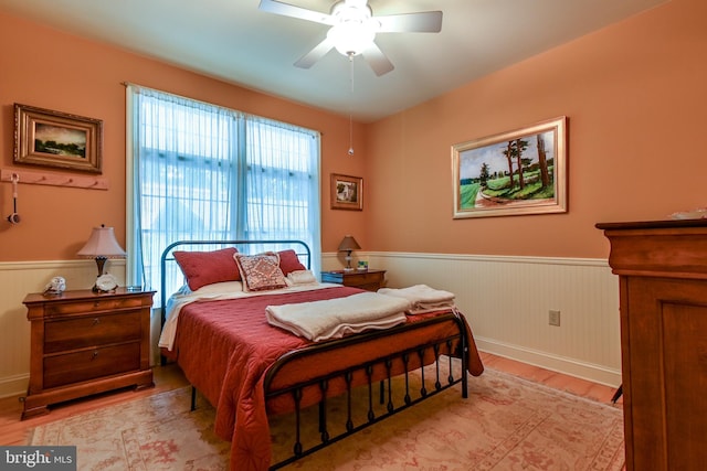 170 Vaughndom Way, Martinsburg, WV 25404 - bedroom with a wainscoted wall, light wood-type flooring, ceiling fan, and baseboards