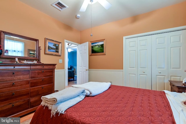 170 Vaughndom Way, Martinsburg, WV 25404 - bedroom featuring a wainscoted wall, a closet, and a ceiling fan