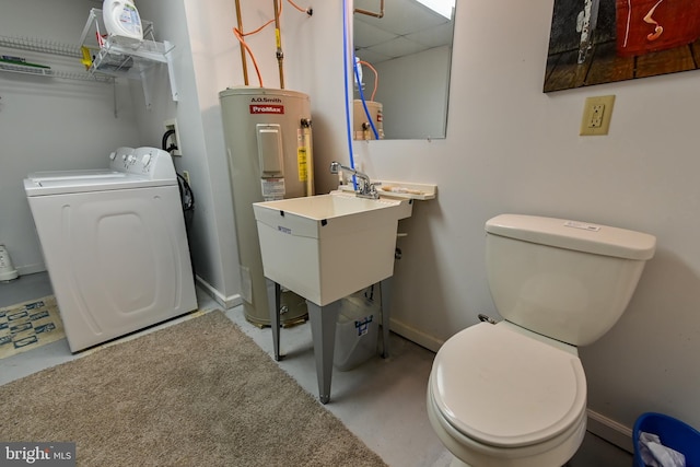 170 Vaughndom Way, Martinsburg, WV 25404 - bathroom with washer / dryer, water heater, toilet, baseboards, and a drop ceiling