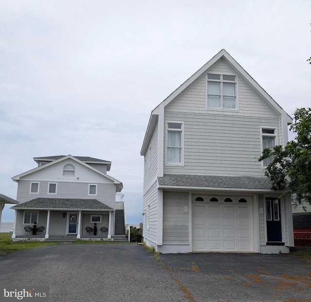 6 Pierces Point Rd, Cape May Court House, NJ 08210 - view of side of property featuring driveway, an attached garage, and covered porch