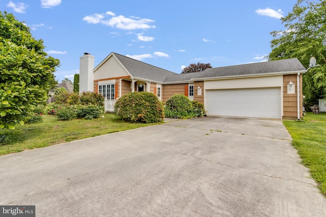 207 Loganberry Ln, Rehoboth Beach, DE 19971 - ranch-style house with driveway, an attached garage, a front lawn, and a chimney