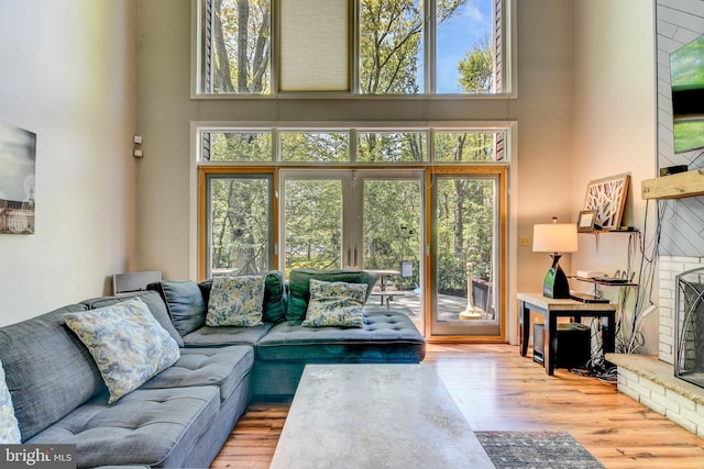 3217 Beech Ridge Dr, Pocono Summit, PA 18346 - living area with a high ceiling, wood finished floors, and plenty of natural light
