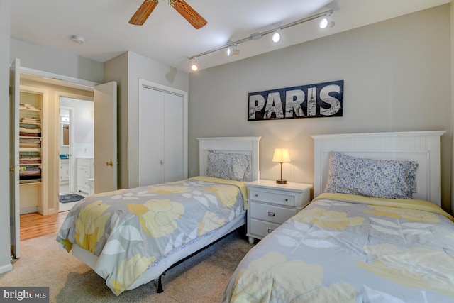 3217 Beech Ridge Dr, Pocono Summit, PA 18346 - carpeted bedroom with rail lighting, a closet, and a ceiling fan