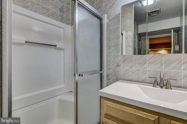 3217 Beech Ridge Dr, Pocono Summit, PA 18346 - bathroom with tile walls, a stall shower, and vanity