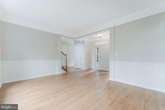 21934 Windover Dr, Broadlands, VA 20148 - unfurnished room with stairs, light wood-style floors, baseboards, and crown molding