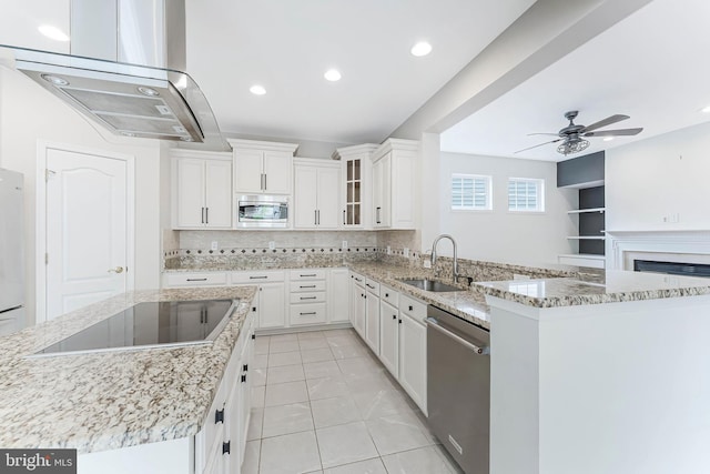 21934 Windover Dr, Broadlands, VA 20148 - kitchen with a sink, appliances with stainless steel finishes, ceiling fan, tasteful backsplash, and island range hood