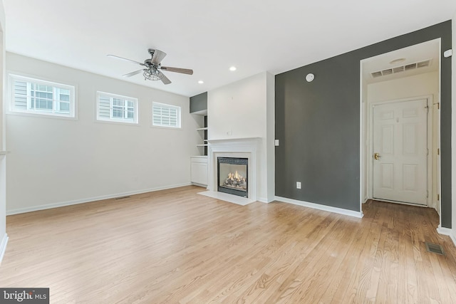 21934 Windover Dr, Broadlands, VA 20148 - unfurnished living room featuring a ceiling fan, healthy amount of natural light, light wood-style flooring, baseboards, and recessed lighting