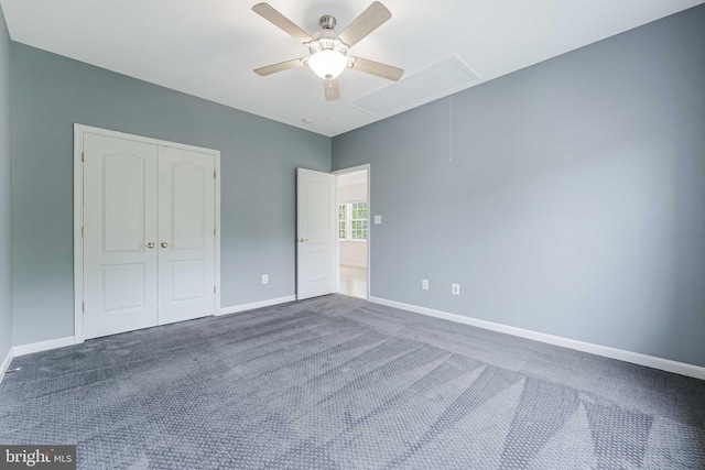 21934 Windover Dr, Broadlands, VA 20148 - unfurnished bedroom featuring attic access, dark colored carpet, a closet, baseboards, and a ceiling fan