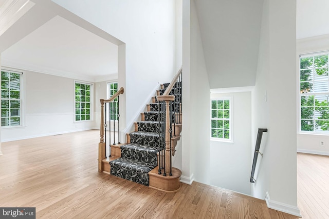 21934 Windover Dr, Broadlands, VA 20148 - staircase with wood finished floors, healthy amount of natural light, and baseboards