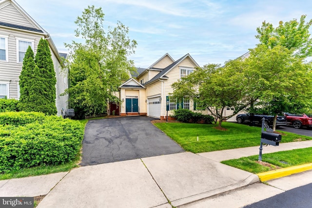 21934 Windover Dr, Broadlands, VA 20148 - traditional home with asphalt driveway, a front yard, and central air condition unit