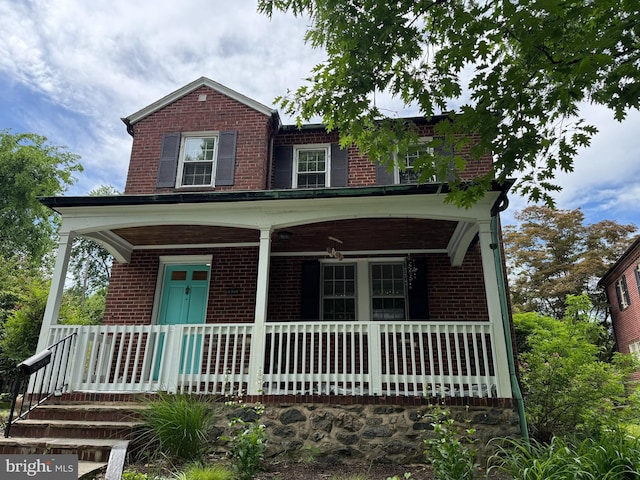 6306 Blackburn Ct, Baltimore, MD 21212 - view of front of home featuring brick siding and covered porch