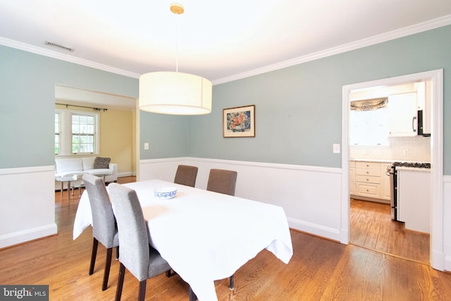 6306 Blackburn Ct, Baltimore, MD 21212 - dining room featuring crown molding and light wood-style floors