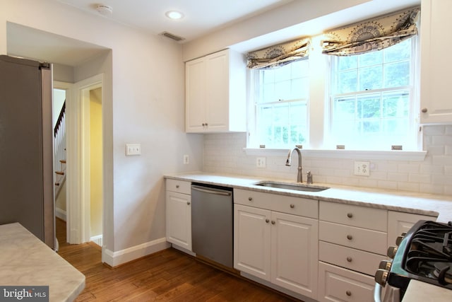 6306 Blackburn Ct, Baltimore, MD 21212 - kitchen with appliances with stainless steel finishes, a sink, white cabinetry, backsplash, and recessed lighting