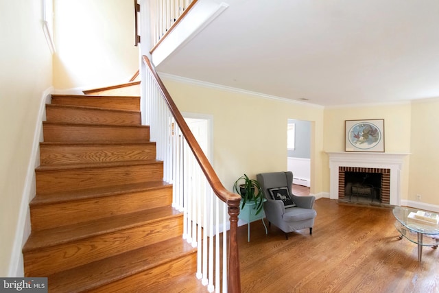 6306 Blackburn Ct, Baltimore, MD 21212 - stairway featuring ornamental molding, wood finished floors, a brick fireplace, and baseboards