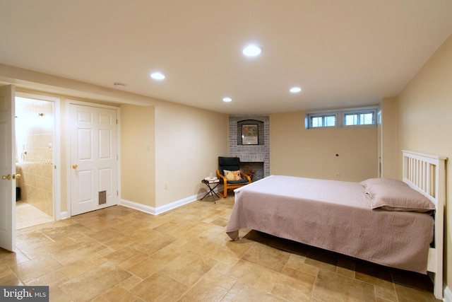 6306 Blackburn Ct, Baltimore, MD 21212 - bedroom with recessed lighting, a brick fireplace, baseboards, and light stone finish flooring