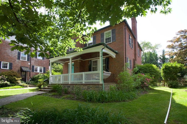 6306 Blackburn Ct, Baltimore, MD 21212 - view of front of house featuring covered porch, a chimney, and brick siding