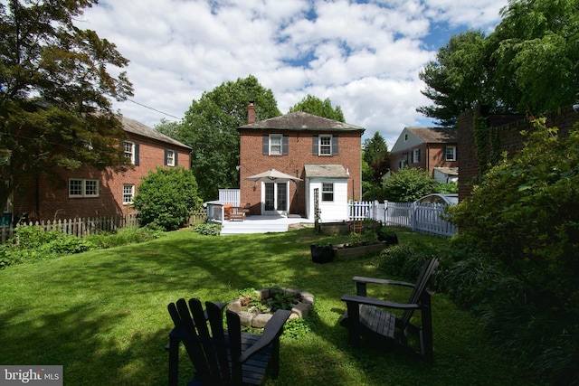 6306 Blackburn Ct, Baltimore, MD 21212 - rear view of property with a chimney, a patio area, and a vegetable garden