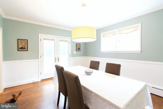 6306 Blackburn Ct, Baltimore, MD 21212 - dining room with ornamental molding, wood finished floors, french doors, and baseboard heating