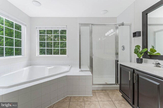 43103 Forest Edge Sq, Broadlands, VA 20148 - full bath featuring vanity, a garden tub, a stall shower, and tile patterned flooring