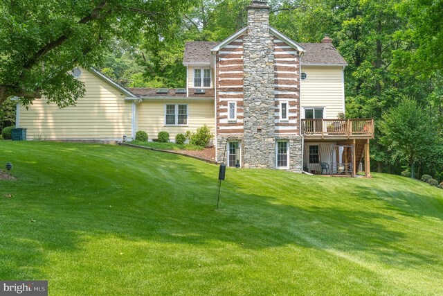 9020 Old Dominion Dr, Mclean, VA 22102 - back of property featuring a deck, a yard, a chimney, roof with shingles, and stone siding