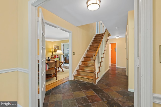 9020 Old Dominion Dr, Mclean, VA 22102 - foyer entrance featuring stone tile floors, baseboards, and stairway