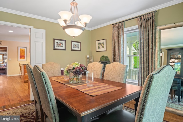 9020 Old Dominion Dr, Mclean, VA 22102 - dining area featuring wood finished floors, crown molding, a chandelier, and baseboards