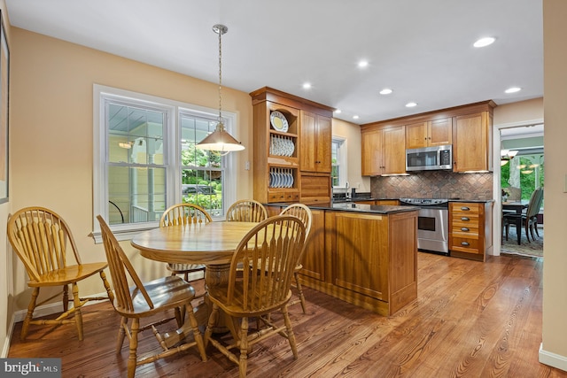 9020 Old Dominion Dr, Mclean, VA 22102 - kitchen with appliances with stainless steel finishes, dark countertops, backsplash, open shelves, and light wood finished floors