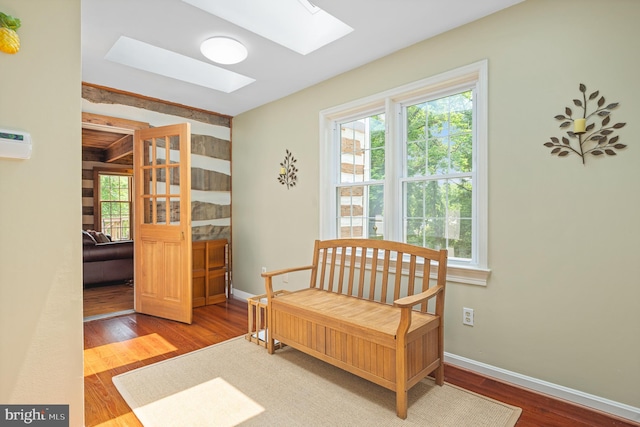 9020 Old Dominion Dr, Mclean, VA 22102 - sitting room with a skylight, plenty of natural light, wood finished floors, and baseboards