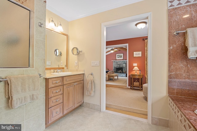 9020 Old Dominion Dr, Mclean, VA 22102 - bathroom with ensuite bathroom, a ceiling fan, a fireplace with raised hearth, vanity, and tile patterned flooring