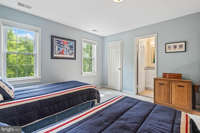 9020 Old Dominion Dr, Mclean, VA 22102 - bedroom with multiple windows, baseboards, ensuite bath, and light carpet