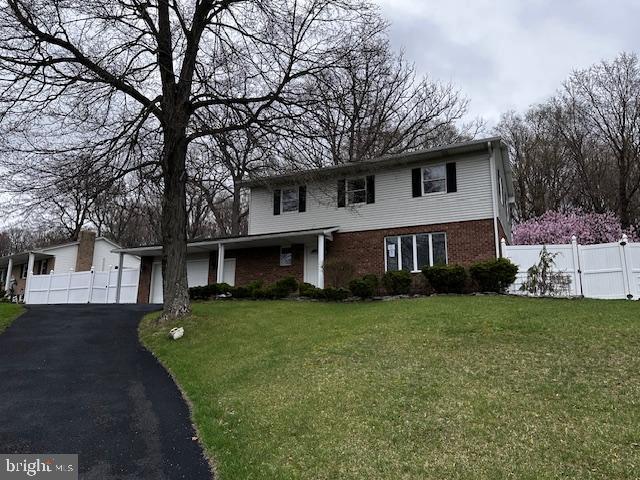 70 Victoria Ln, Frostburg, MD 21532 - view of front facade with brick siding, driveway, and a garage