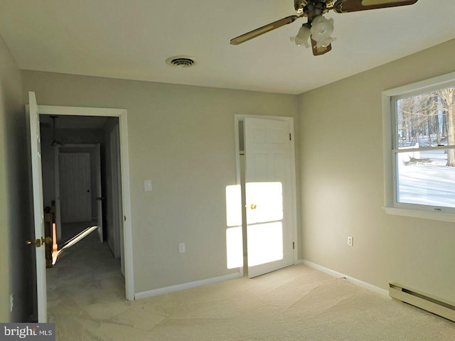 70 Victoria Ln, Frostburg, MD 21532 - unfurnished bedroom with baseboard heating, light colored carpet, baseboards, and a ceiling fan