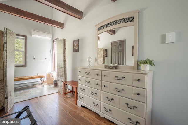7572 Eagle Rock Dr, Tobyhanna, PA 18466 - bedroom with a wall mounted air conditioner, beam ceiling, dark wood-style floors, and a baseboard radiator