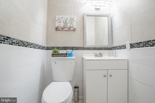 7572 Eagle Rock Dr, Tobyhanna, PA 18466 - bathroom with tile walls, toilet, and vanity