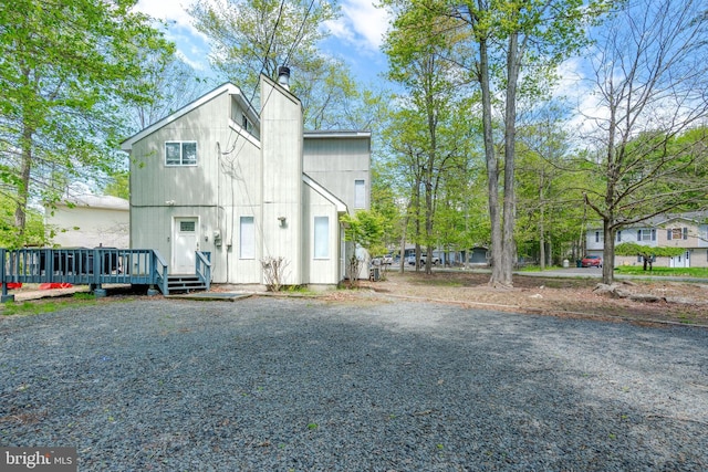 7572 Eagle Rock Dr, Tobyhanna, PA 18466 - view of front of home with a chimney and a wooden deck