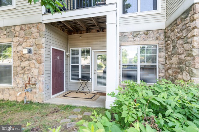 5170 William Colin Ct, Centreville, VA 20120 - property entrance with stone siding and a balcony