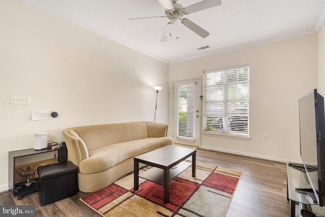 5170 William Colin Ct, Centreville, VA 20120 - living area featuring wood finished floors, crown molding, a ceiling fan, and baseboards