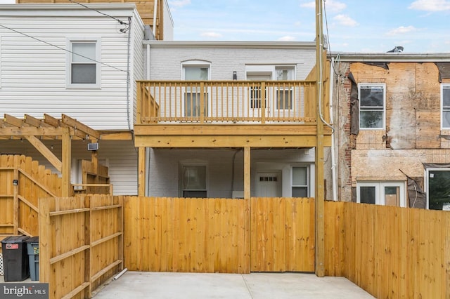 2132 E Federal St, Baltimore, MD 21213 - rear view of house with a deck and brick siding