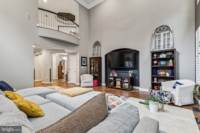 13128 Kahns Rd, Manassas, VA 20112 - living room with ornate columns, wood finished floors, a high ceiling, and baseboards