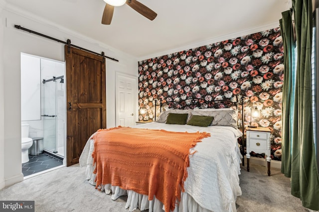 13128 Kahns Rd, Manassas, VA 20112 - bedroom with a barn door, carpet floors, connected bathroom, a ceiling fan, and crown molding