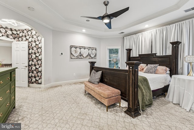 13128 Kahns Rd, Manassas, VA 20112 - bedroom with a tray ceiling, ornamental molding, recessed lighting, baseboards, and arched walkways