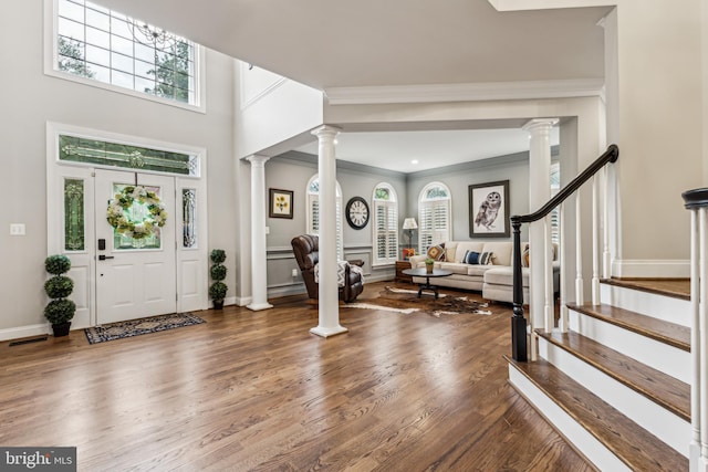 13128 Kahns Rd, Manassas, VA 20112 - foyer with wood finished floors, ornamental molding, decorative columns, and baseboards