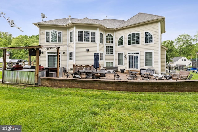 13128 Kahns Rd, Manassas, VA 20112 - back of property with a patio and a yard