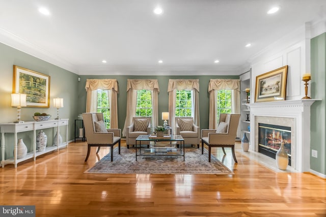6249 Auburn Leaf Ln, Alexandria, VA 22312 - living room with healthy amount of natural light, light wood-type flooring, recessed lighting, crown molding, and baseboards