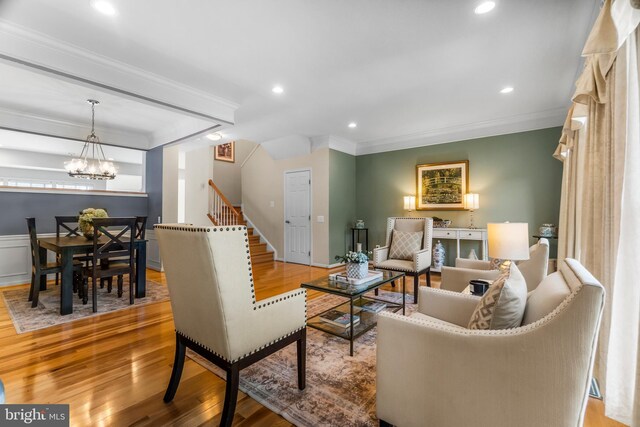 6249 Auburn Leaf Ln, Alexandria, VA 22312 - living room with ornamental molding, stairs, wood finished floors, a chandelier, and recessed lighting