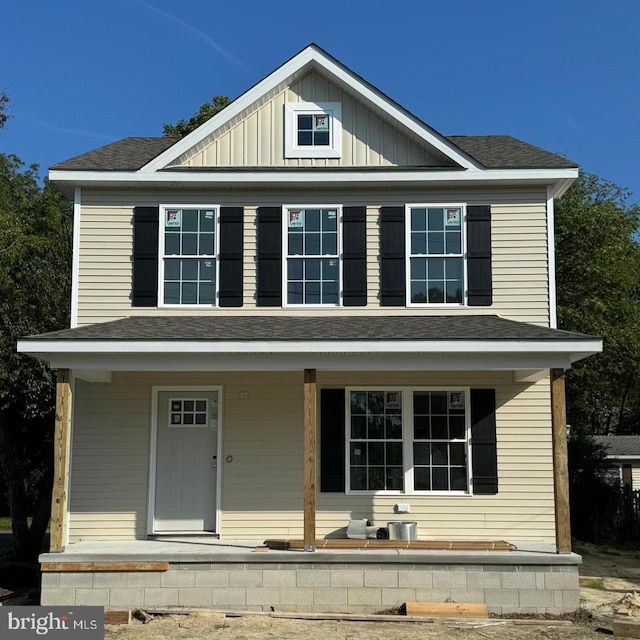 21 W Mispillion St, Harrington, DE 19952 - view of front facade featuring a porch, board and batten siding, and roof with shingles